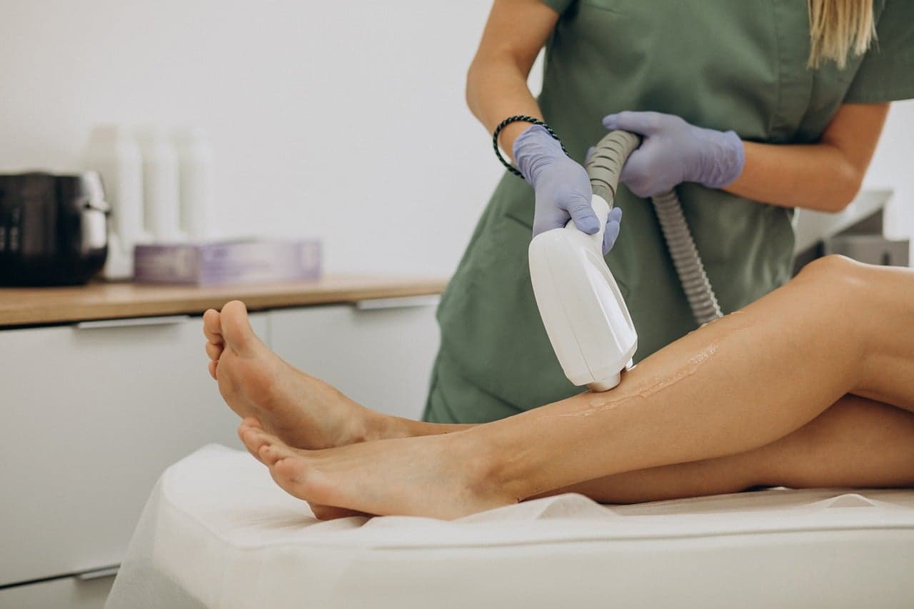 Laser hair removal on a client's legs